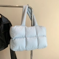 Light blue quilted down tote bag with long shoulder straps and puffer texture design - Blue
