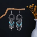 Close-up of vintage silver boho earrings with turquoise beads hanging on a dry branch - Silver Turquoise Hollow Pendant(E5700-1)
