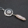 Pink quartz hexagonal bullet pendant with silver moon sun motif and wire wrap detail - Sun + Rose Quartz