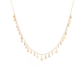 Detailed shot of golden layered titanium necklace with star and sun charms on white base - Star and Sun Design Style (12)