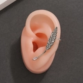 Silver feather ear cuff with cubic zirconia studs shown on a silicone ear model - Silver Feather Zirconia Ear Hook Style (1296)