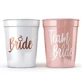 Close-up of pink and white plastic party shot cups with Bride and Team Bride text - White (Large)