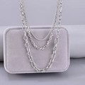 Minimalist silver multi-layer stainless steel curb chain necklace on jewelry stand - Silver