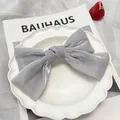 Elegant grey satin oversized bow hair clip with silky texture for thick hair volume - Ice Cream Grey