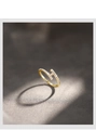 Detailed close-up of gold-plated silver ring with H-shaped zircon setting and S925 stamp - Gold