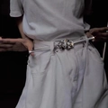 Silver metallic waist chain with detailed rose floral buckle on white clothing - Silver Single Rose Waist Chain