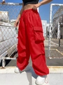 Women's baggy cargo pants in bright red featuring drawstring waist and large side pockets - M / Red