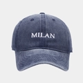 Detailed view of white MILAN embroidery on washed navy blue denim vintage baseball cap - Adjustable / Navy Blue