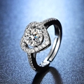 Macro detail of silver heart-shaped moissanite ring with micro-paved band and round center stone - Y117 Heart Halo Pave