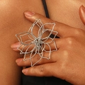 Detailed macro shot of silver hollow-out flower ring with woven metal wire texture - Silver Flower Ring (7431)