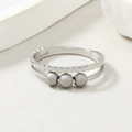 Macro detail of silver double-layered titanium steel ring with rotating frosted beads - Double Layer Steel Color Frosted Beads