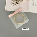 Detail view of a 9x9cm semi-transparent frosted jewelry bag with secure zip closure - 50 Silk Pink Frosted Zipper Bag / 9x9cm