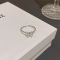 Detailed macro view of silver butterfly ring with micro-set zircon on twisted rope band - Adjustable Open / Silver - Bowknot Zirconia