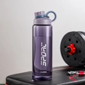 Detailed view of a purple sports water bottle on a gym bench next to dumbbells - 1000ml / Purple