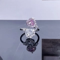 Macro detail of bypass ring with heart shaped pink and white gemstones in halo setting - Style 7 Double Heart Bypass Open Ring