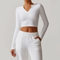 Slim fit long sleeve white yoga top with high-stretch fabric and sporty V-neck cut - S / Tops / Swan White