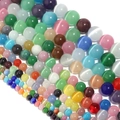 Makroaufnahme bunter runder Katzenaugen-Perlen für DIY-Schmuck und Bastelarbeiten - Durchmesser 6mm (ca. 60 Stk.) / bunt