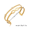 Detail of gold double-layered bangle with infinity symbol, beads and cubic zirconia - Double Layer Infinity Rhinestone