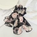 Detail of floral chiffon scrunchie with long ribbon streamers in black and pink design - Black Floral With Trim