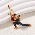 Artistic golden brooch with dancers in red and black enamel on a textured surface - Dancing Couple Style (YNCP5442)