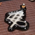 Creative black ceramic backflow incense burner with waterfall smoke effect on bamboo mat - Buddha