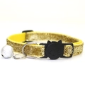 Sparkling gold pet collar with a black cat-face buckle and silver bell on white background - Yellow