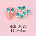 Detailed macro view of 11.5x8mm blue heart rhinestone bow nail charms with gold alloy base - Gold Base Blue (AC21)