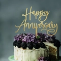 Golden Happy Anniversary acrylic cake topper on a white cream cake with blackberries - Anniversary Style / Gold