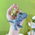 Mini grey T-Rex dinosaur game console keychain with golden bell and ring accessory - Gray