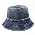 Detail of vintage washed denim bucket hat with a round metallic logo emblem - M (56-58cm) / Dark Blue