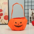 Halloween pumpkin candy bag made of orange felt with a classic Jack-o-lantern face - Pumpkin Bag C