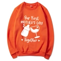 Orange Mama Est 2025 sweatshirt with Our First Mother's Day Together print - Orange