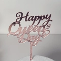 Close-up of rose gold mirror acrylic Happy Queen's Day cake topper decoration - Rose Gold Happy Queens Day
