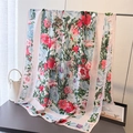 Detail of floral silk scarf with vibrant red and blue patterns draped on a stand - White (XD35-1)