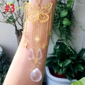 Detail of golden butterfly suncatcher with crystal ball prism for garden and home decor - Gold Butterfly Sun Crystal Ball
