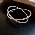 Macro shot of silver-tone layered crisscross bracelet with sparkling zircon stones - Style 18 (Crisscross) / Silver