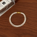 Macro detail of gold baguette-cut zircon tennis bracelet on dark wood background - Full Zircon Large Square
