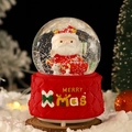 Christmas musical snow globe with Santa figure on a festive red diamond-textured base - 80 Medium Music+Light / Style 40 Gift Box