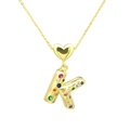 Macro shot of 18K gold plated letter K pendant with multi-colored zircon stones and heart bail - Letter-K