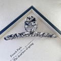 Top view of a large black and white marble acetate hair claw clip on canvas prop - Black and White