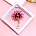 Elegant gold daisy brooch with purple enamel petals in a white suspension display stand - XZ153 Red-Purple Daisy-Boxed