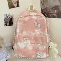 Detail of pink tie-dye canvas backpack with cute plush bear pendant and cartoon badges - With 4A Badge and Blush Bear / Pink