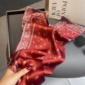 Pink paisley patterned silk scarf tied as a headband with a luxurious satin finish - Paisley Pattern