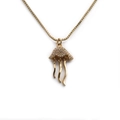 Elegante collana a forma di medusa dorata con micro-zirconi scintillanti e catena - Oro
