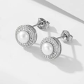 Close-up of S925 sterling silver stamp and micro-set zircons on pearl stud earrings - 925 Silver / White