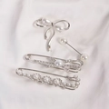 Set of four silver bow and pearl safety pins with rhinestones for waist adjustment - No. 7 Silver Cross 5-Piece Set