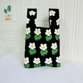 Floral knit tote bag with white flower patterns and green leaves on black background - Small Floral Black / Black
