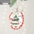 Christmas glove wooden ornament with Let it Snow text hanging on pine tree branch - Christmas Tree Mitten
