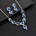 Close-up of sapphire blue and diamond bridal jewelry set with necklace and earrings - 498 Light Blue 2-Piece Set / Light Blue