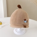 Close-up of baby winter knit hat showing brown dog embroidery and leather tag detail - 1-3 Years / Khaki